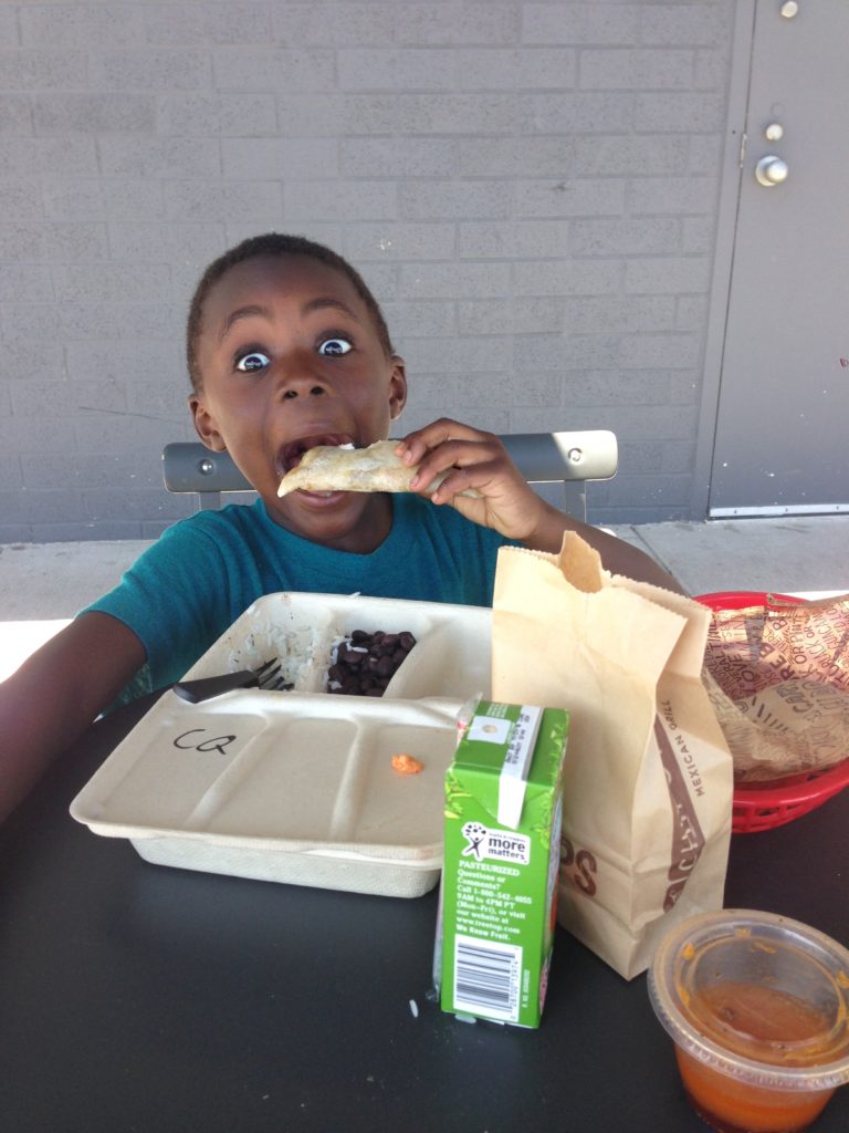 african american boy eating